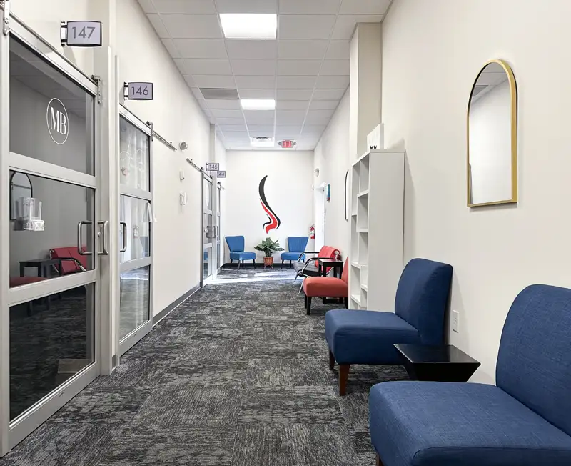 view down a hallway out sidethe suites at Gallery of Hair Colorists suites